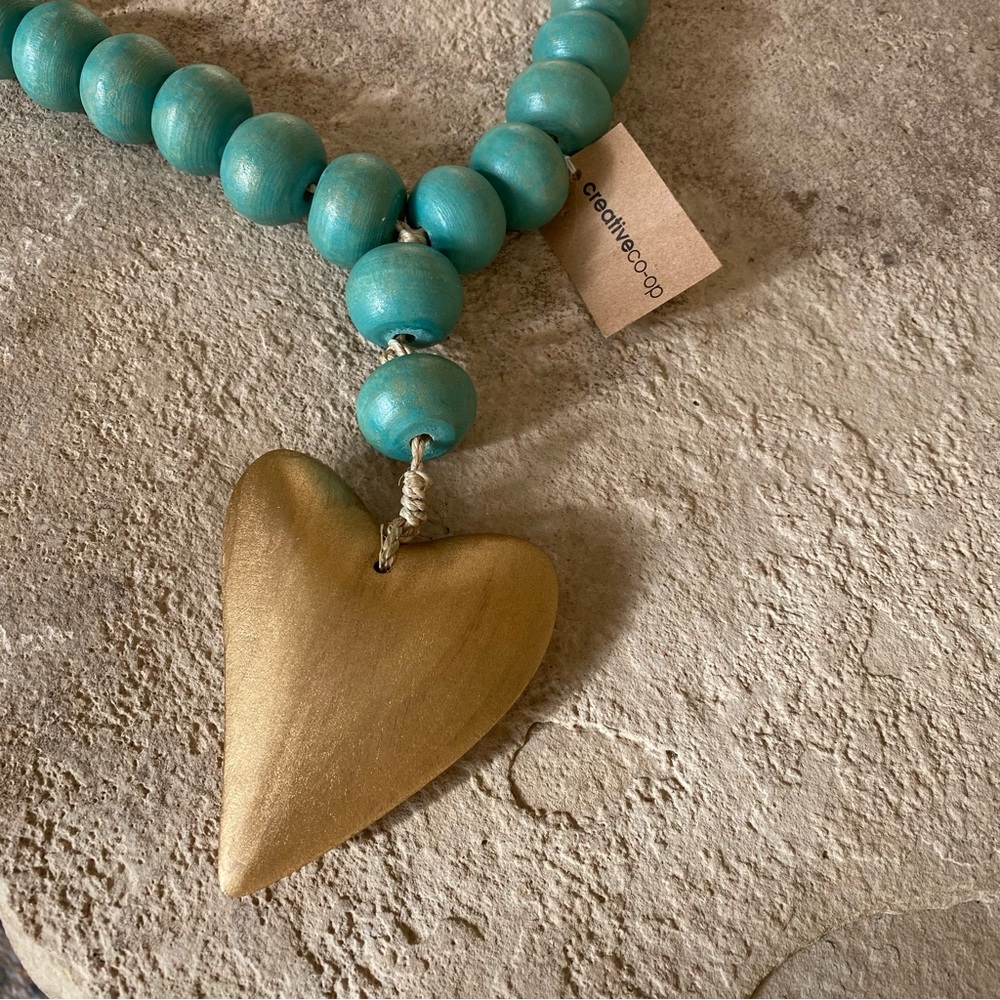 Large 22” mango wood beaded necklace with heart. Made in Philippines.